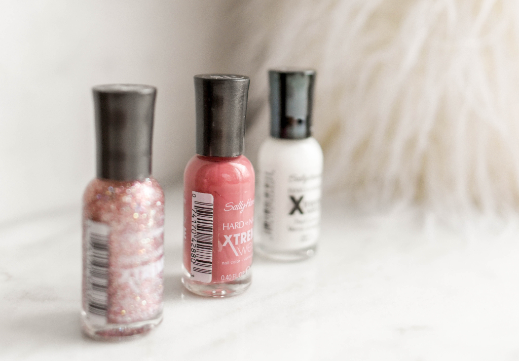 white pink and glitter nail polish