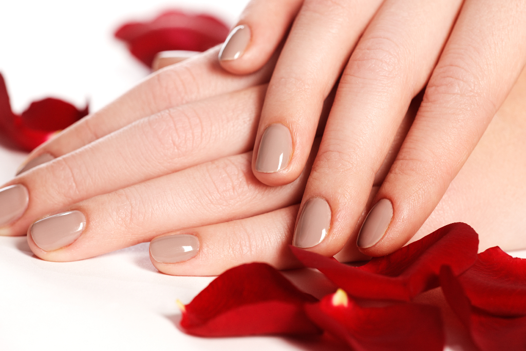 womans hands with beige manicure