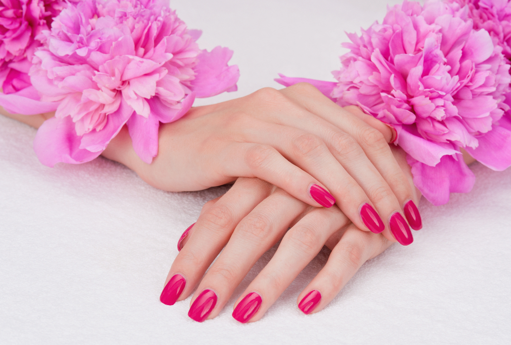 female hands with pink manicure