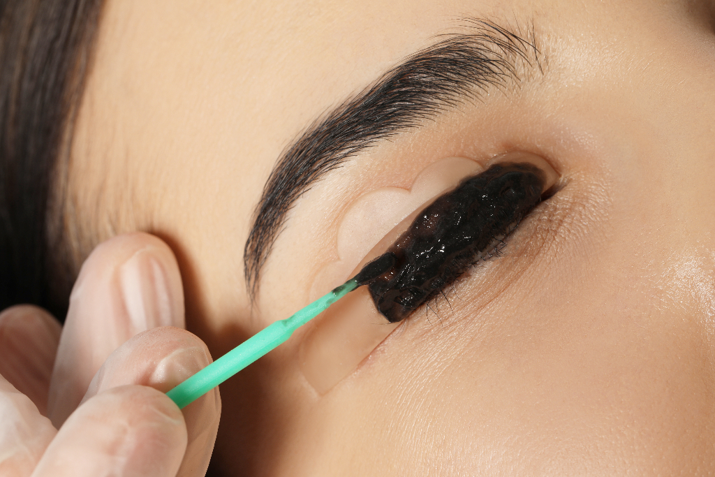 woman undergoing eyelash lamination and tinting