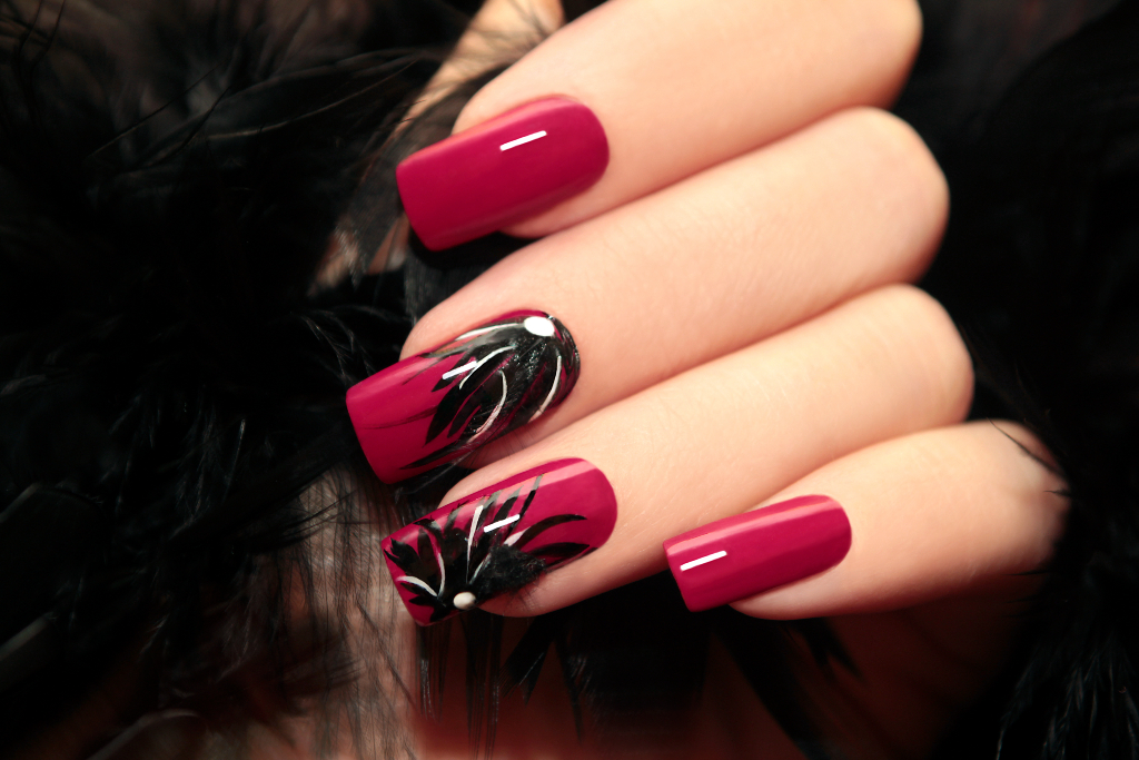 woman with burgundy manicure
